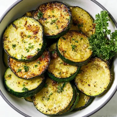 Delicious sautéed zucchini served as a side dish with garlic and herbs.