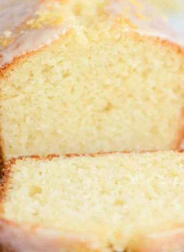 Delicious sourdough discard lemon cake with a golden crust and frosting.