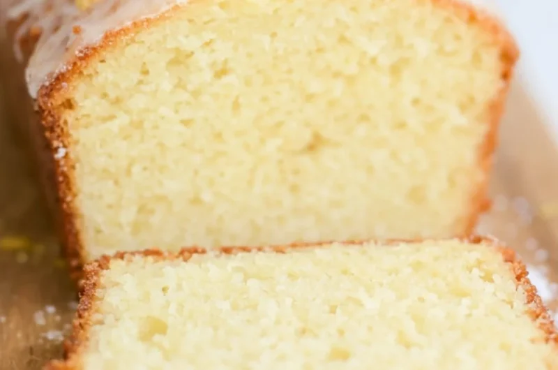 Delicious sourdough discard lemon cake with a golden crust and frosting.
