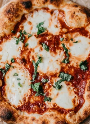 Delicious homemade sourdough pizza crust topped with fresh ingredients